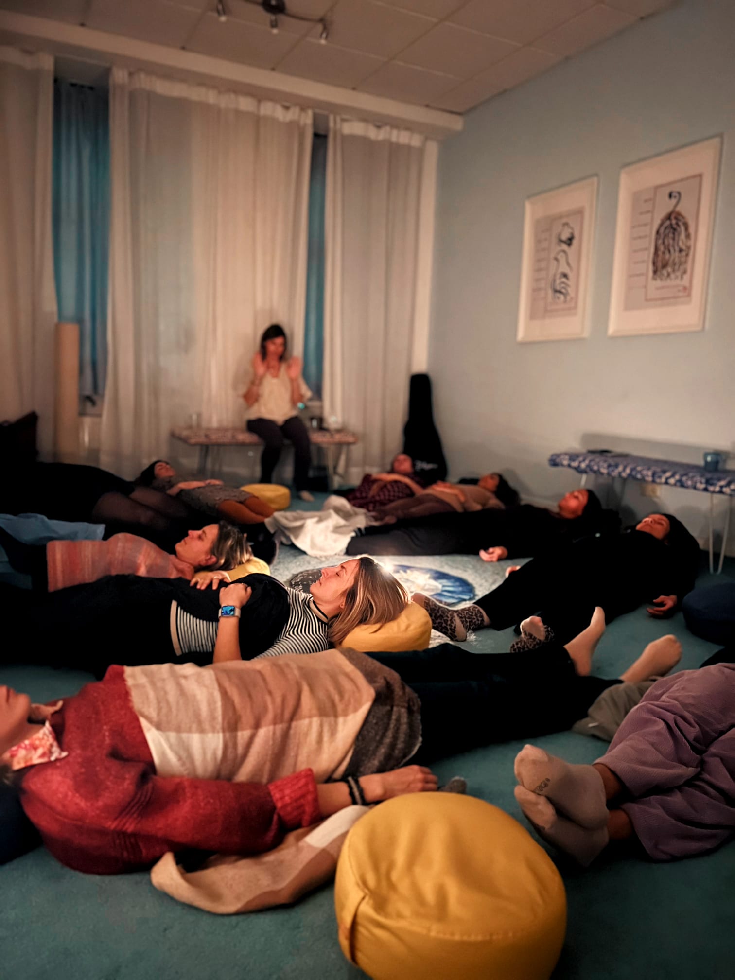 Women resting together in candlelight