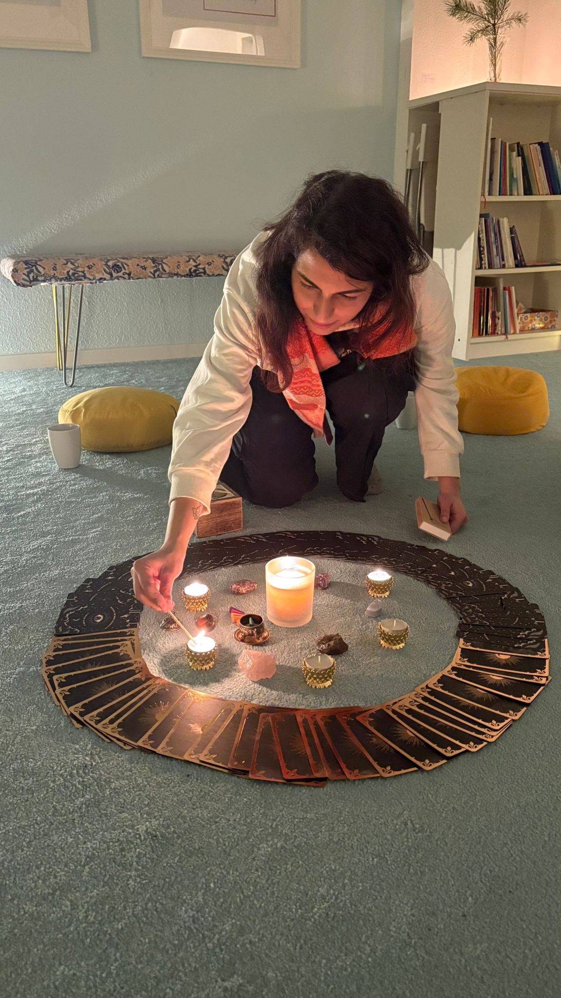 Ritika lighting candles in a sacred circle