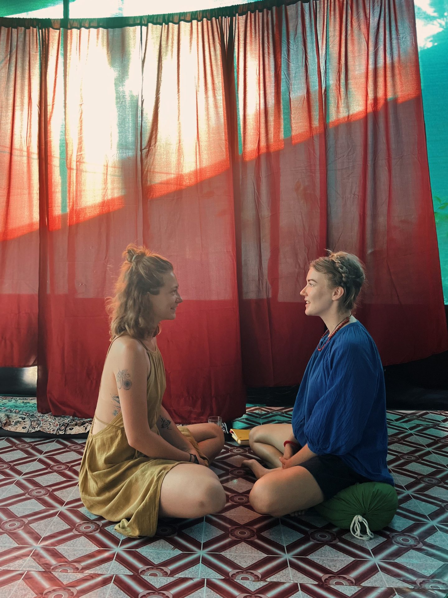 Women sitting in an open circle outdoors