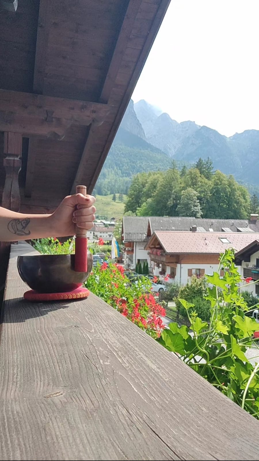 Tibetan singing bowl on a balcony with mountain views