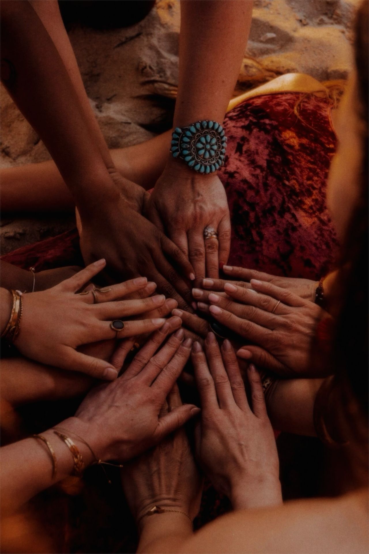 Women's hands joined in a circle